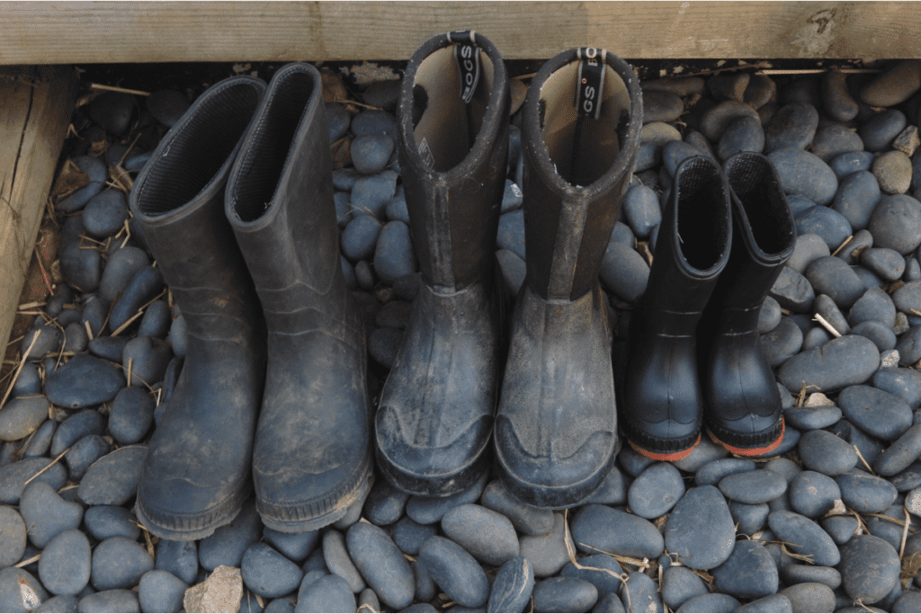 3 pairs of kid boots in a rock washing station