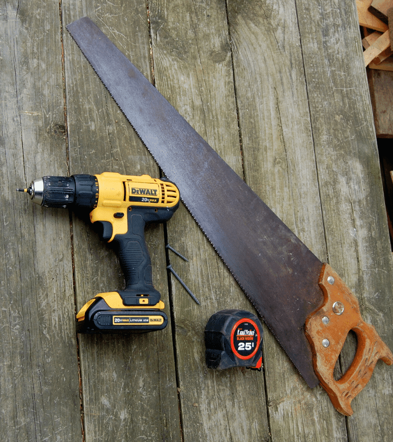 hand saw, cordless drill, measuring tape and screws