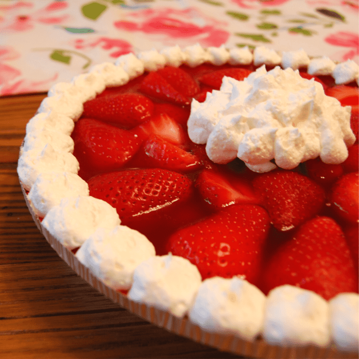 close up of strawberry pie with cool whip