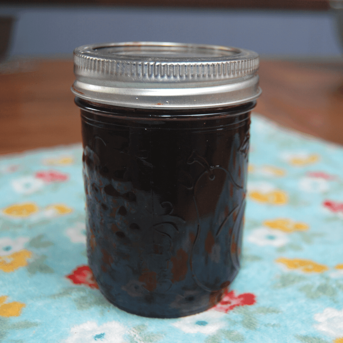 close up of jar of blackberry jelly